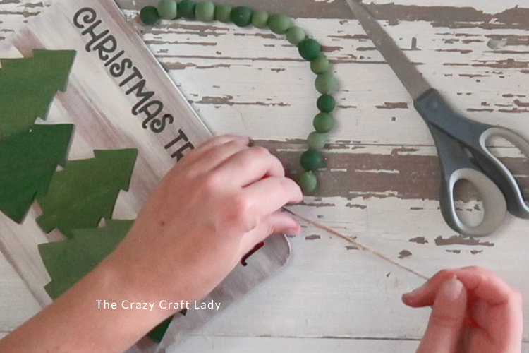 hang sign with wood bead garland