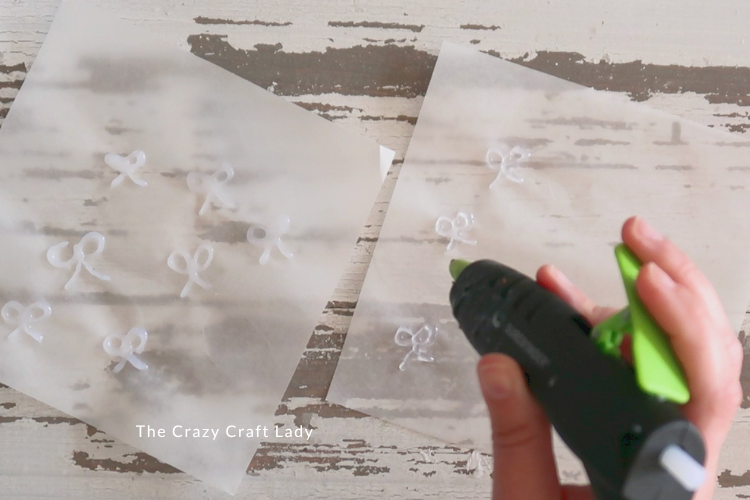 hot glue bow shapes onto parchment paper