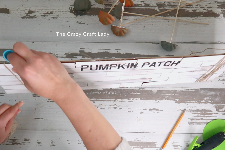 make a twine hanger for the sign