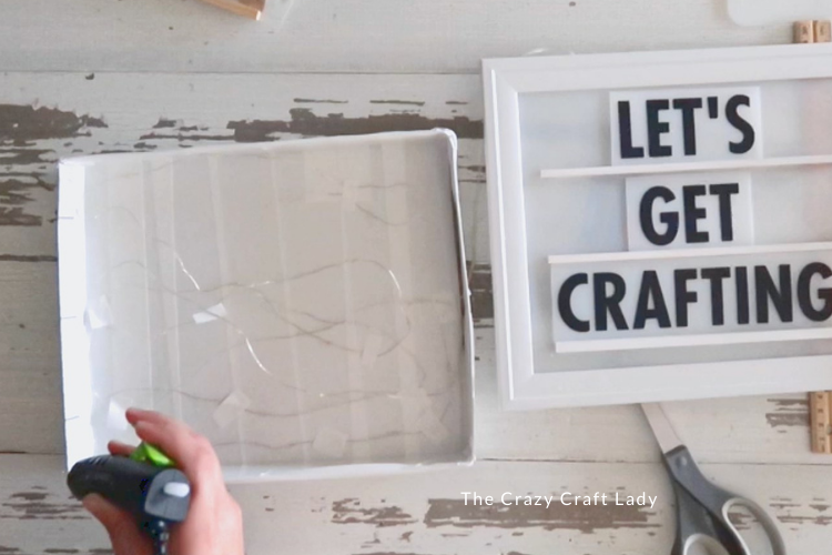 hot glue picture frame to shoebox lid