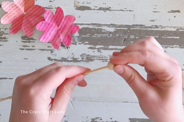 create flower base with skewer and wood bead
