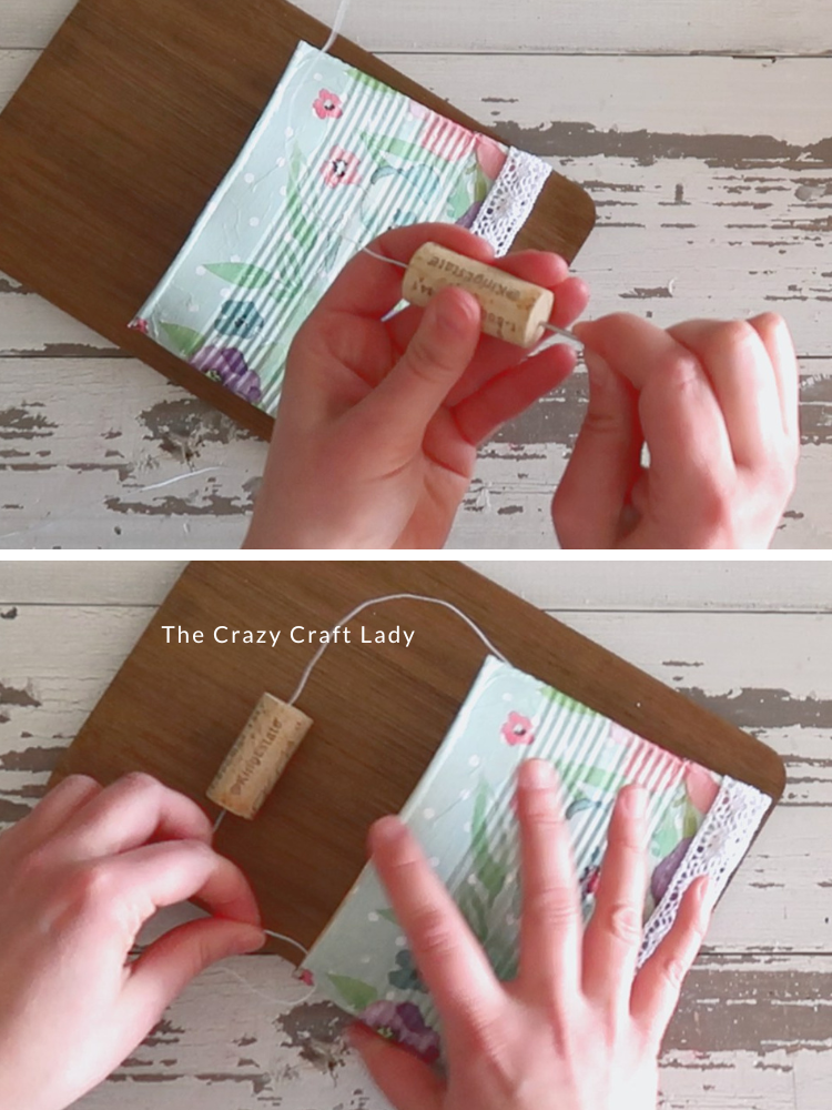 make a hanger with white wire and wine cork