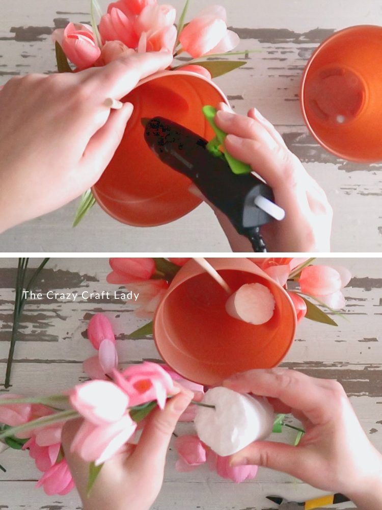 run second pot through dowel and add foam with flowers