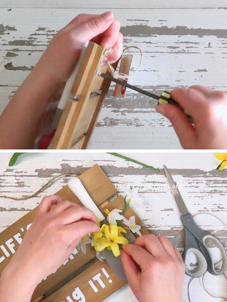screw shovel handle to sign and add faux flowers