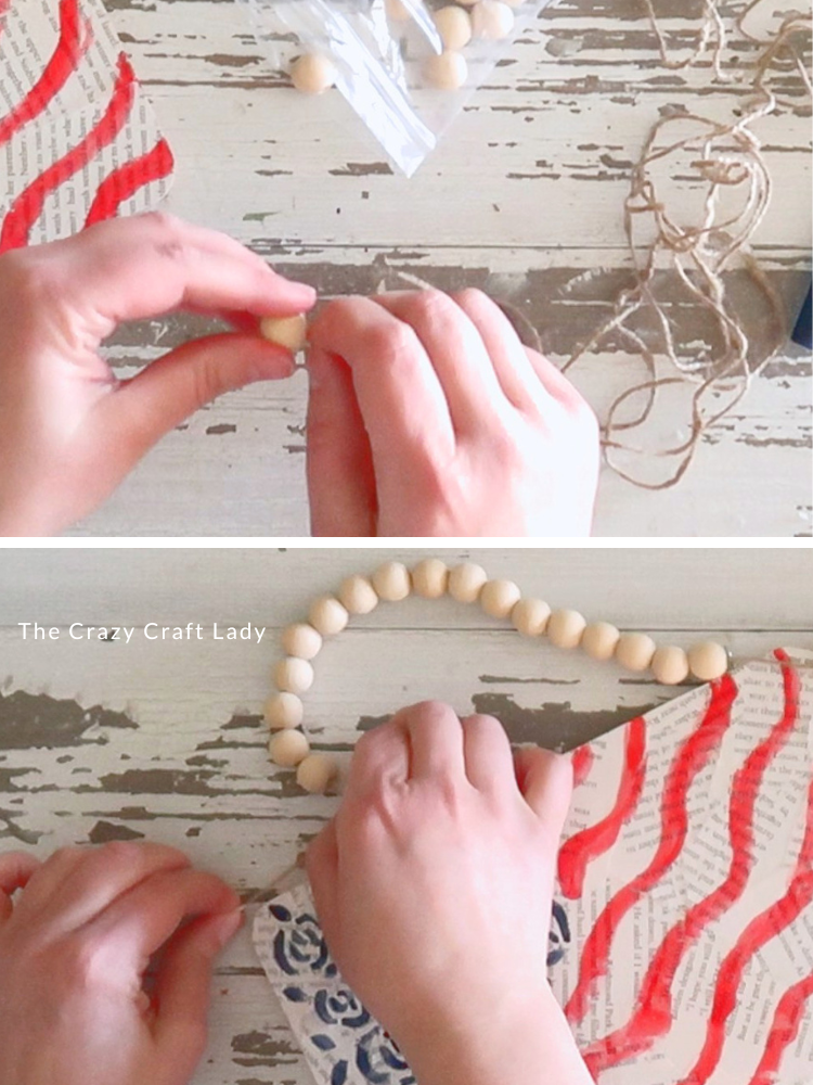 string up wood beads to make hanger