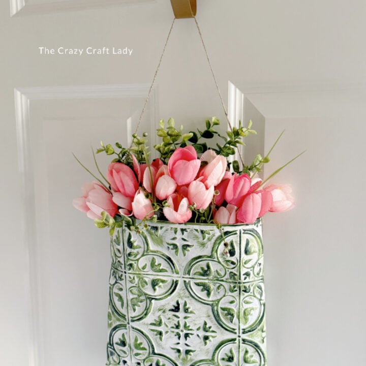green and white tin tile floral wall pocket with pink tulips