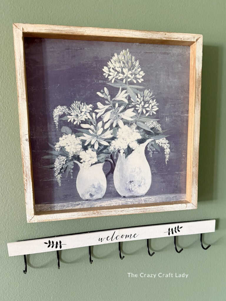upgrade plain metal wall hooks with wood embellishment