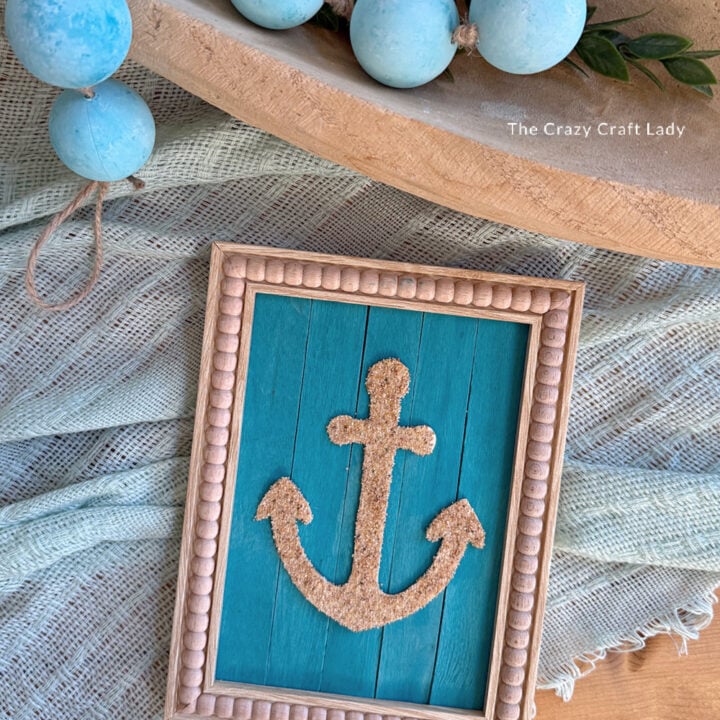 DIY Sand Anchor Art on a Slatted Teal Background