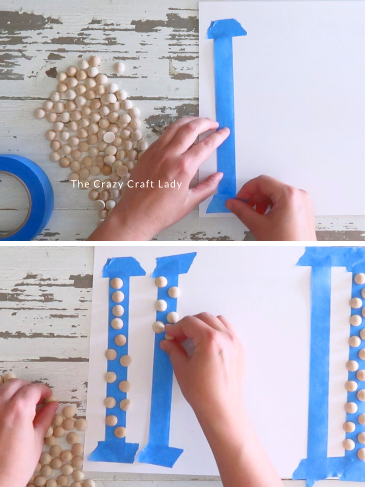 lay down tape sticky side up and attach wood half balls