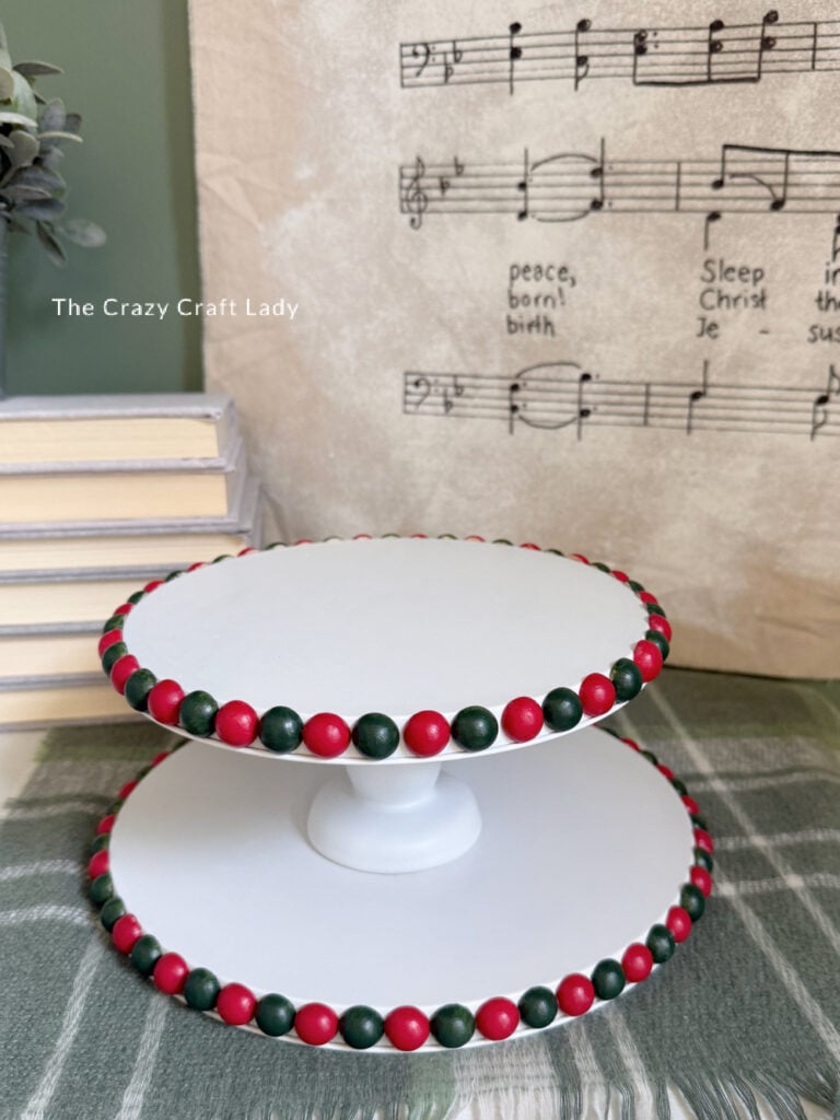 white tiered tray craft with green and rer Christmas bobbin edge detail