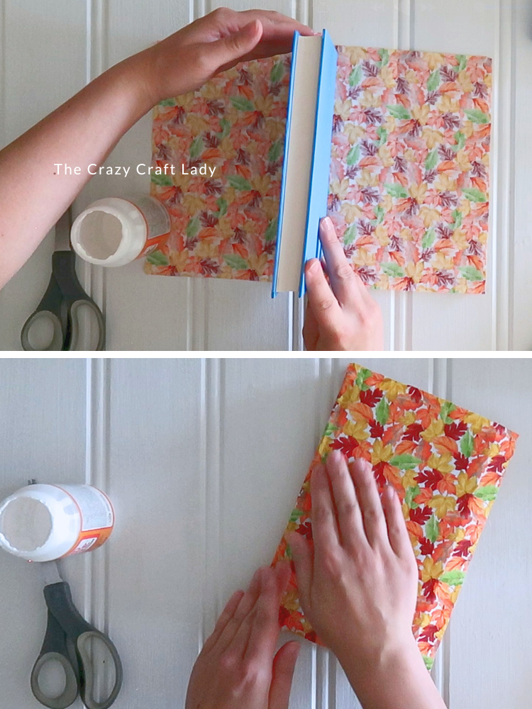 center book on fabric and smooth over the cover