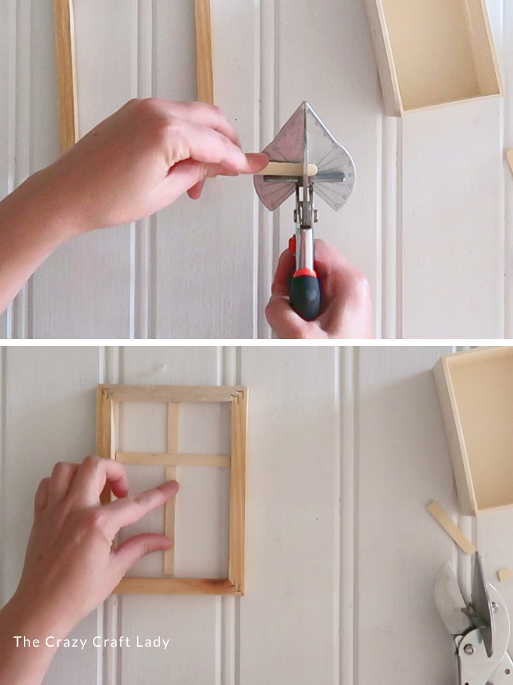 cut popsicle sticks to form window panes