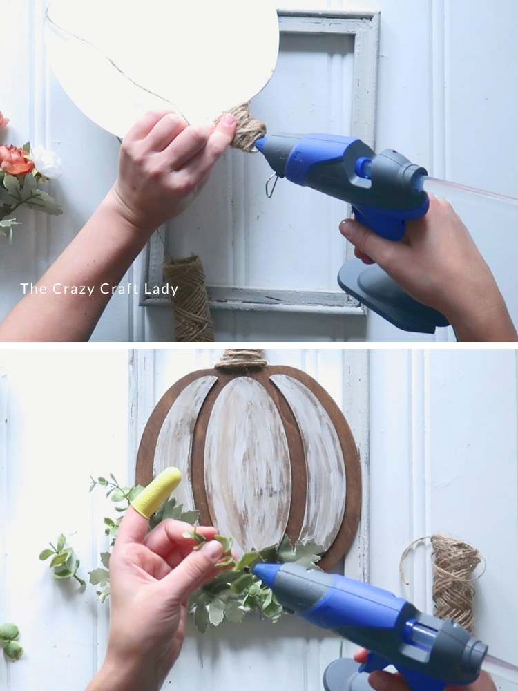 embellish pumpkin with twine and faux greenery