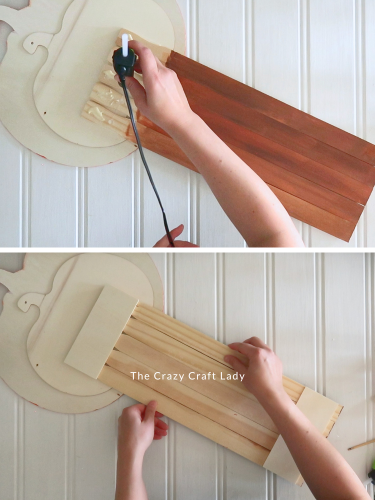 glue the wood panel to the jack-o-lantern