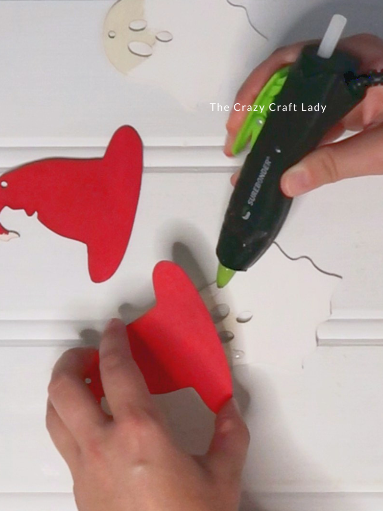 hot glue red hat to white ghost