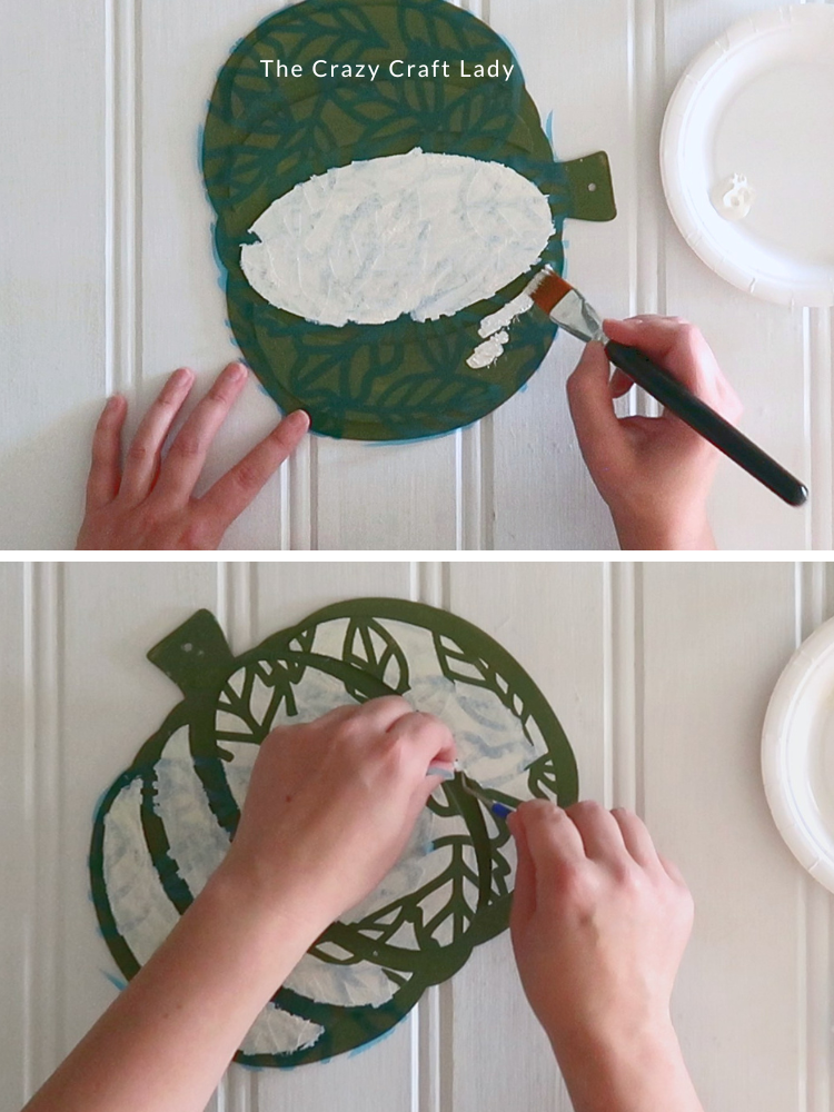 paint cream paint over stencil and remove stencil