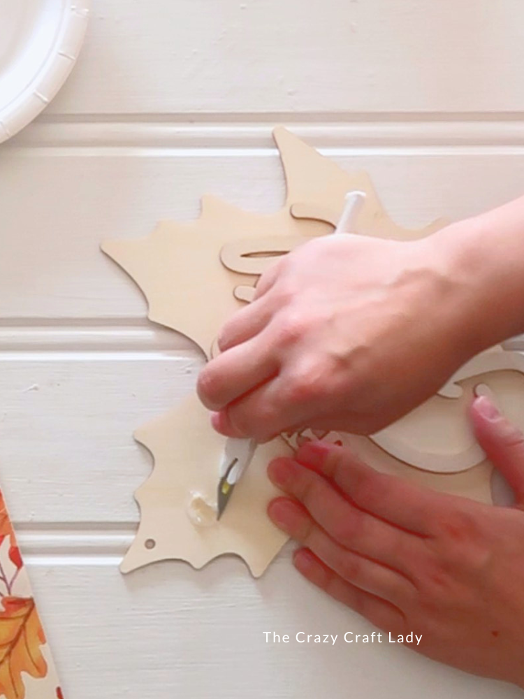remove embellishment and hot glue from wood leaf cutout