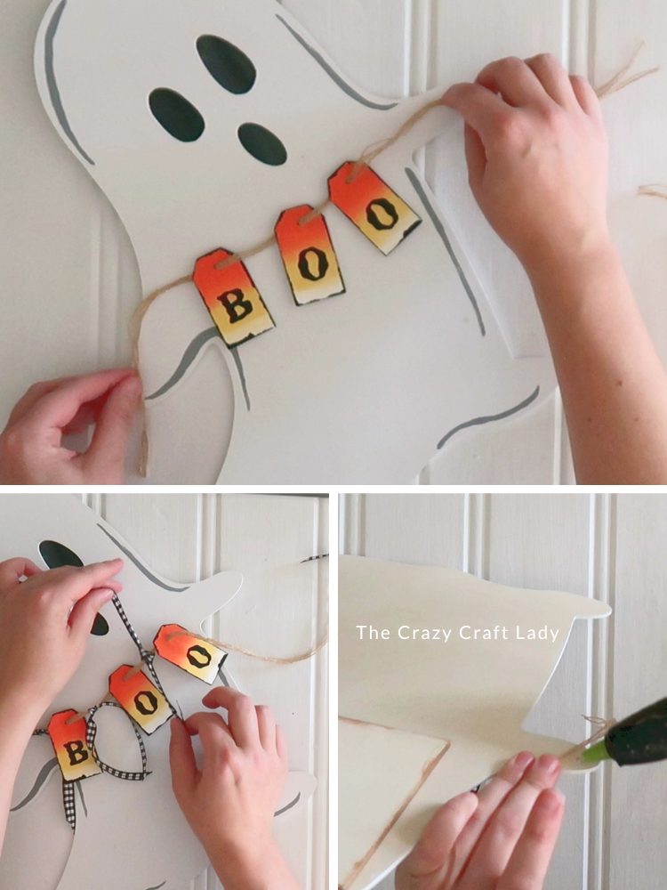 string up BOO tags between ghost hands and add black and white ribbon