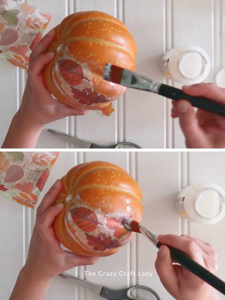 add Mod Podge to pumpkin and then seal napkin piece to pumpkin with more Mod Podge