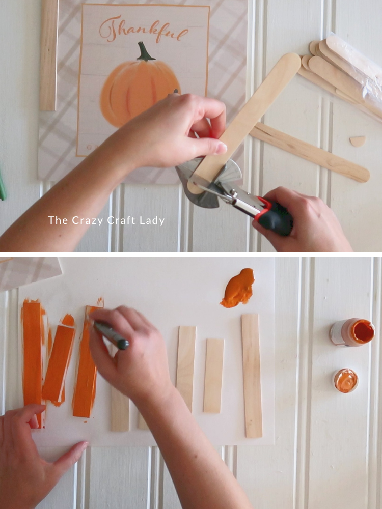 cut jumbo wood craft sticks and paint orange