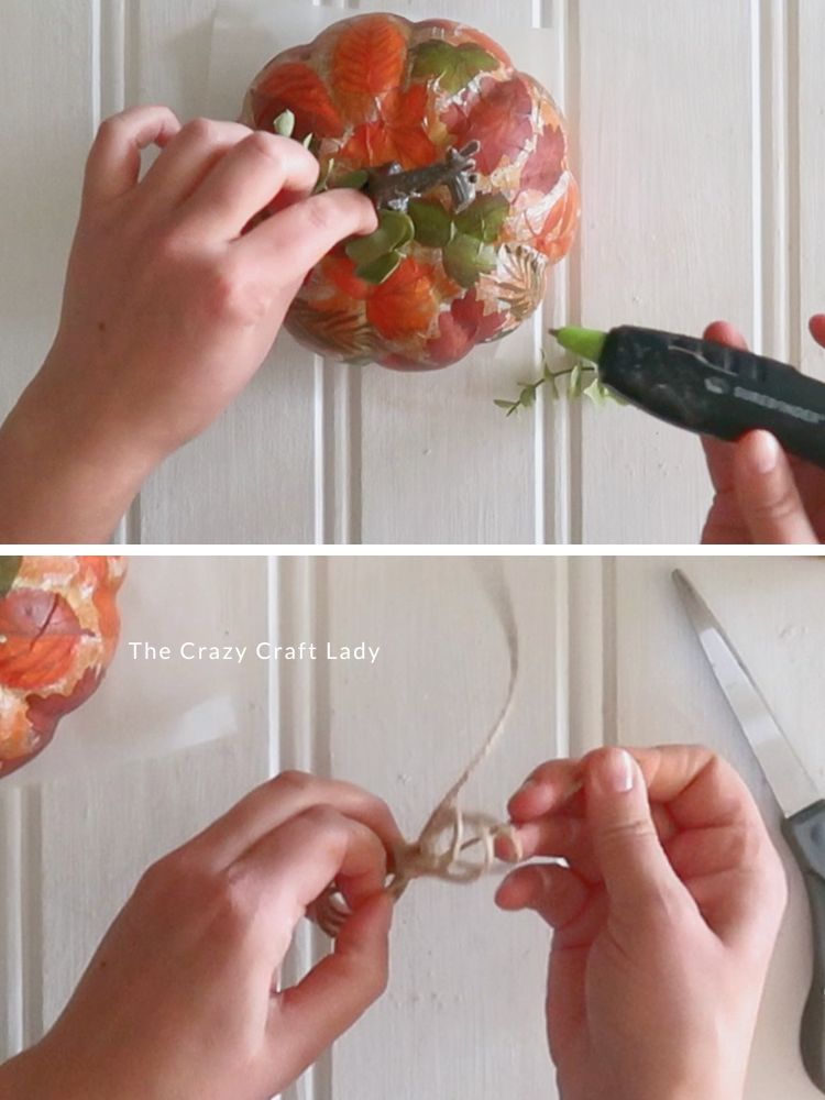 hot glue faux greenery and twine bow to pumpkin top