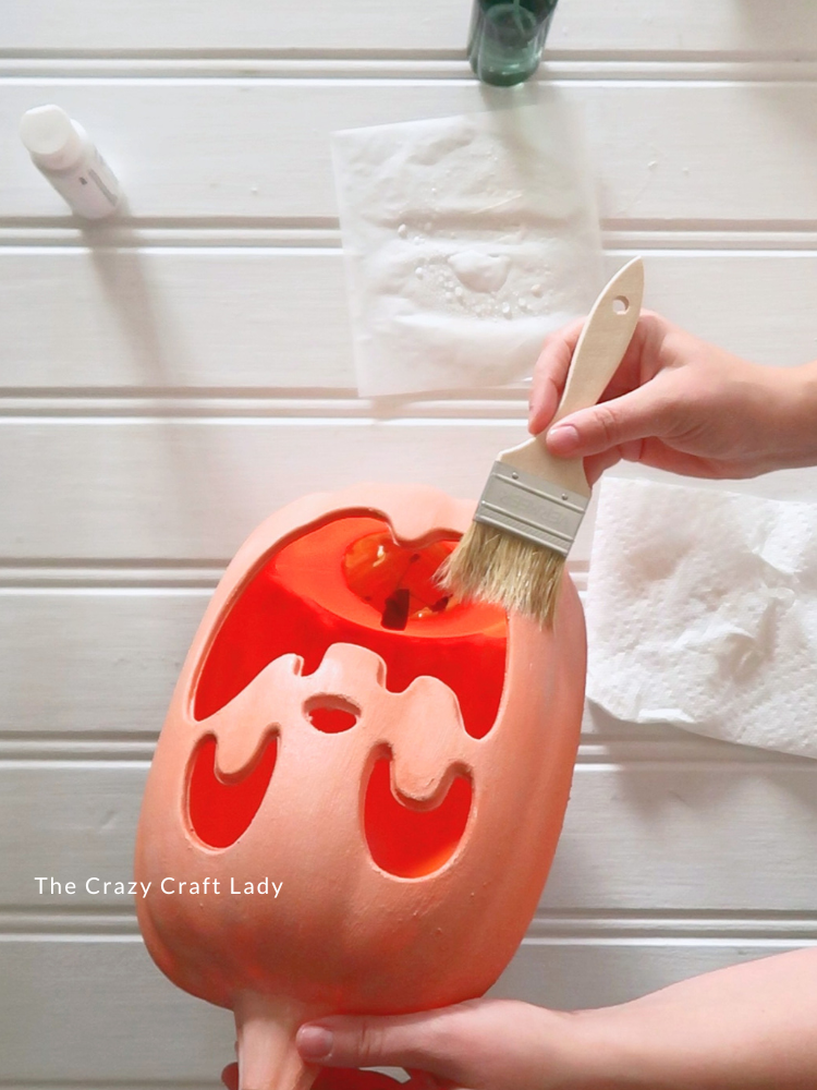 white wash the orange jack o lantern with a chip brush