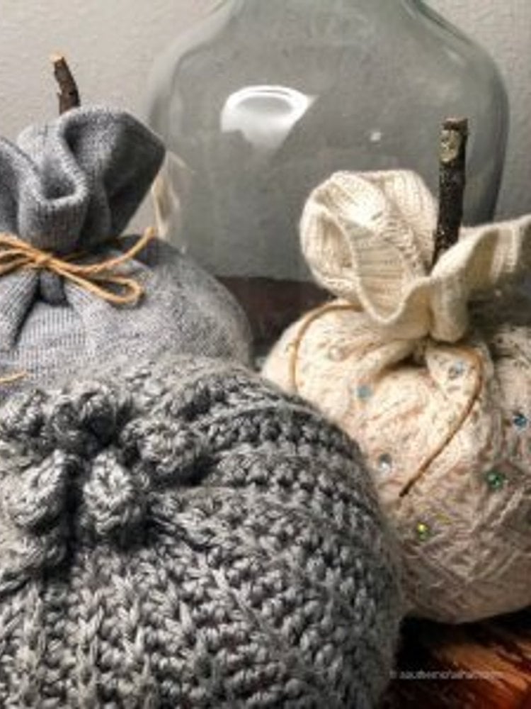 Dollar Tree foam pumpkins tucked inside knit beanie hats