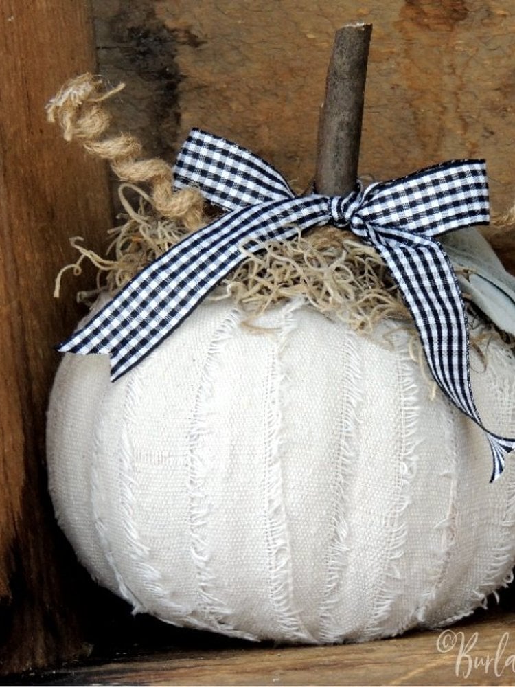 Drop cloth covered Dollar Tree foam pumpkin with gingham bow