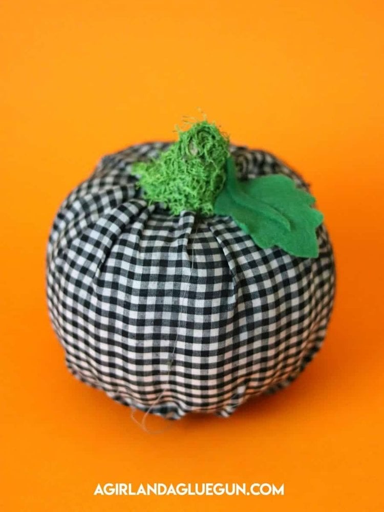 Gingham fabric covered Dollar Tree foam pumpkin with paper stem