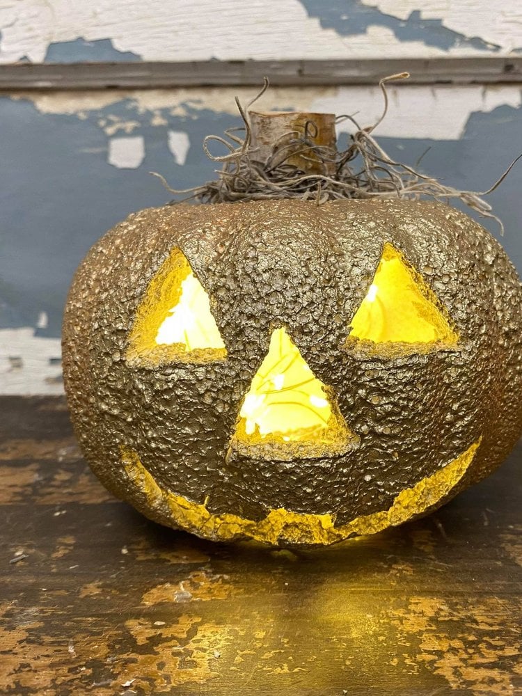 Gold spray painted jack-o-lantern from a Dollar Tree foam pumpkin