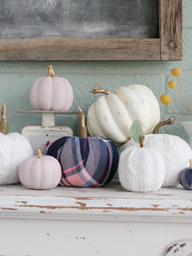 Sweater and flannel covered dollar store foam pumpkins