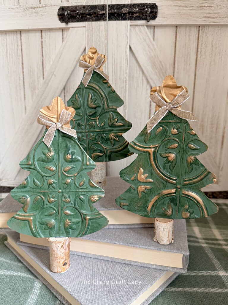 Green faux tin tile Christmas trees with antique gold distressing